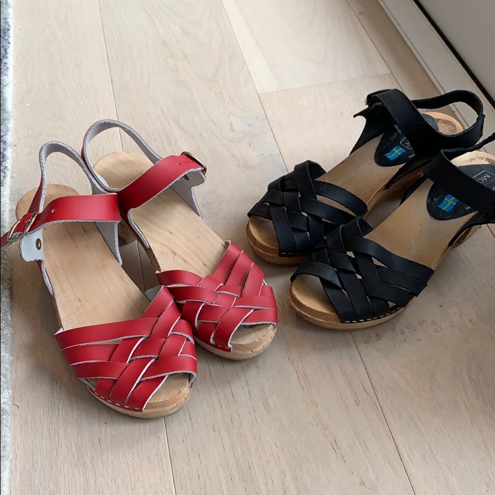 Two pairs of Moheda clogs. Red and black leather